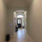 Front entrance hallway with white painted walls and tile flooring