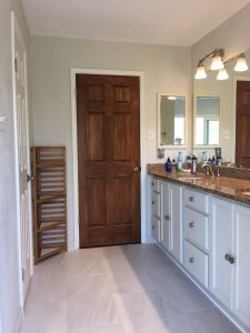 Bathroom countertop with white cabinets installed by Bay Area Paint & Tile